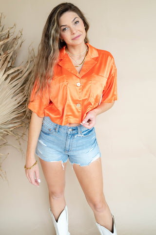 orange silky blouse